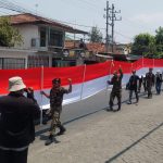 Tumbuhkan Nasionalisme-Patriotisme, Seribu Banser Jombang Kirab Merah Putih Raksasa